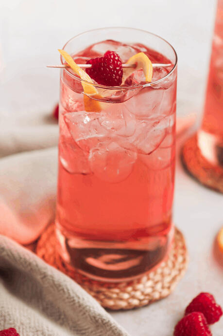 My Sister&#39;s Girlfriend - 10k gil ( A pink raspberry lemonade with peach blossom vodka served with a skewer of raspberries and lemons )